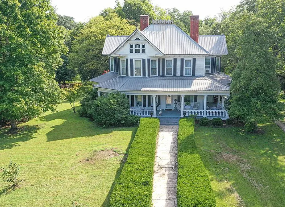 Porch goals! Pretty interior! Five acres in South Carolina. $399,000