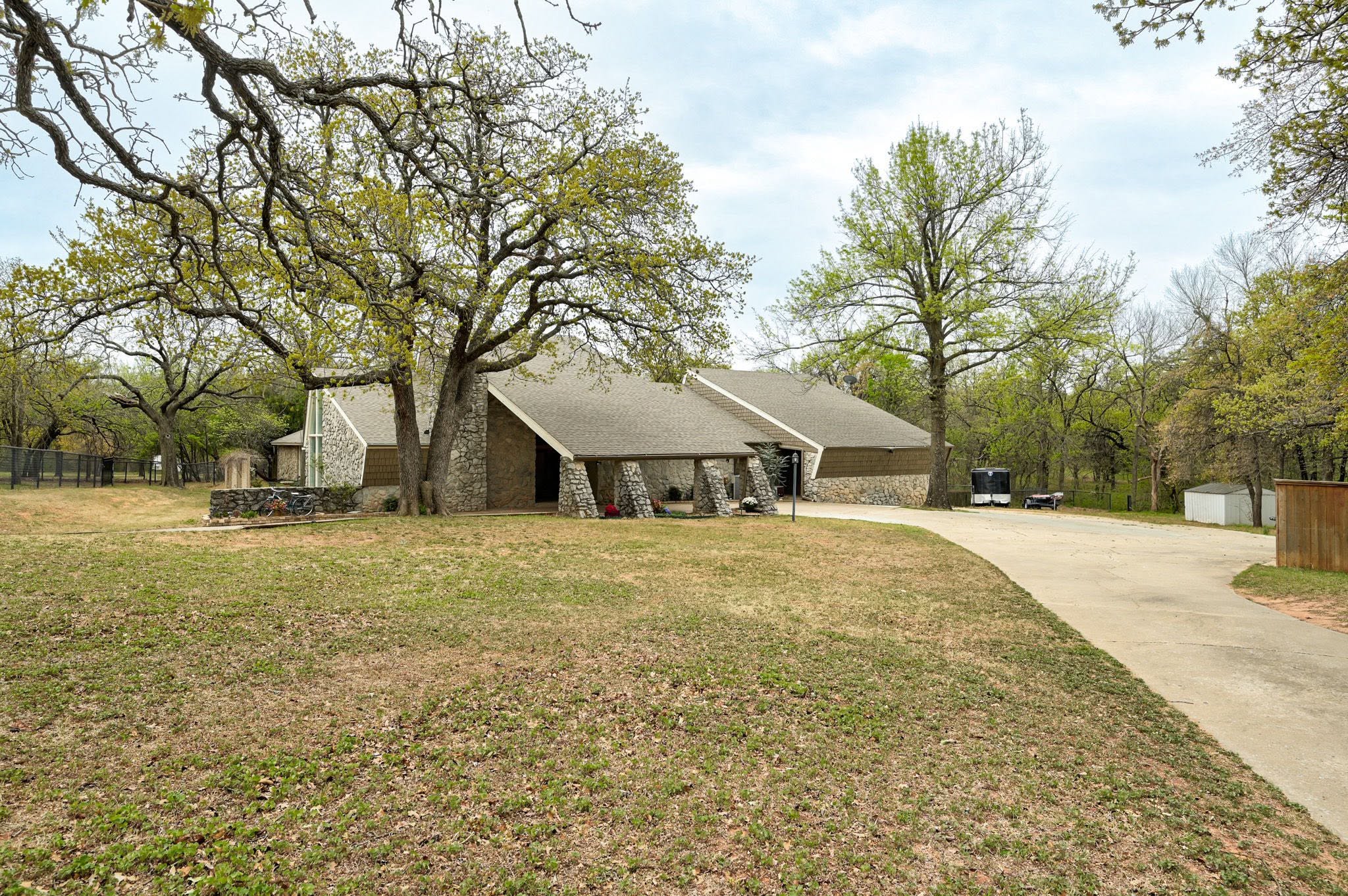 Maximalist Mid-Century Modern Stone Lodge in Edmond