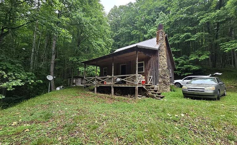 Secluded Cabin on 16 Acres with Stocked Pond and Endless Potential
