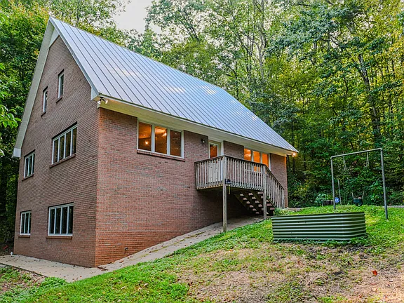 84.8 Acres with a Custom Brick Home, Barn, and Year-Round Creek in Lawrenceburg, Tennessee
