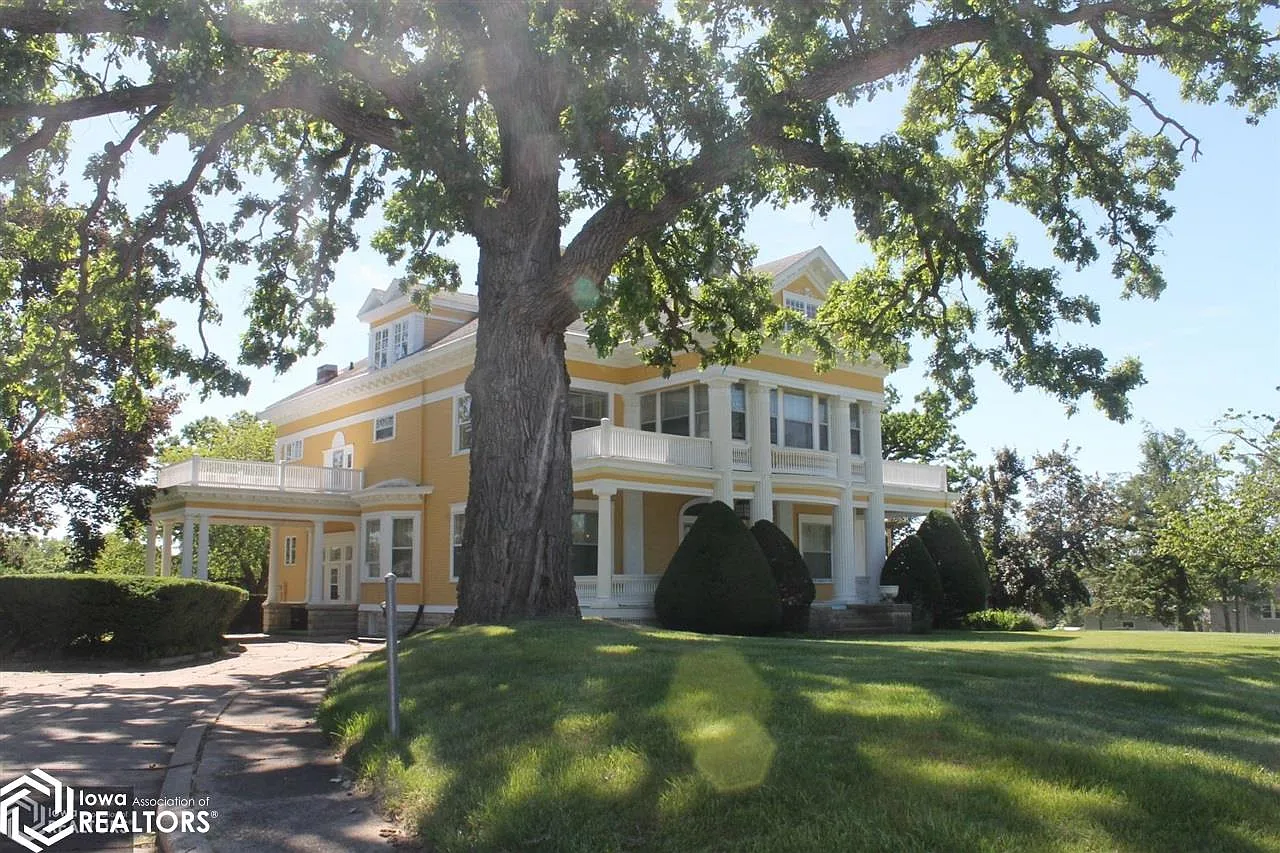 Own The Historic Cherry Mansion! Love the staircase! On over three acres! C. 1903 in Iowa. $275,000.